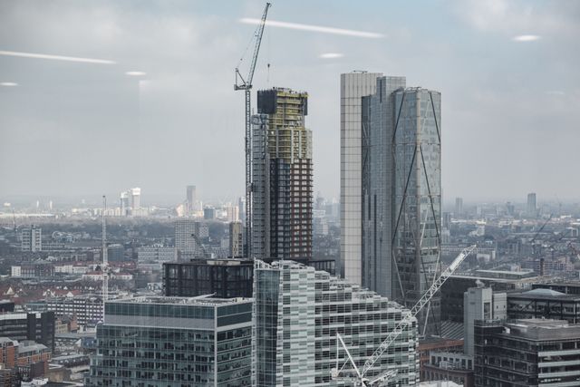 Skyscrapers under construction with cranes